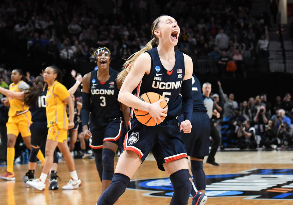 Paige Bueckers celebrates on the court during a game