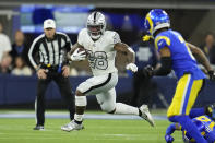 FILE - Las Vegas Raiders running back Josh Jacobs runs with the ball during the first half of an NFL football game against the Los Angeles Rams, Thursday, Dec. 8, 2022, in Inglewood, Calif. Jacobs was hampered by injuries in 2020 and '21 but showed how dangerous he can be when healthy last season. (AP Photo/Marcio Jose Sanchez, File)