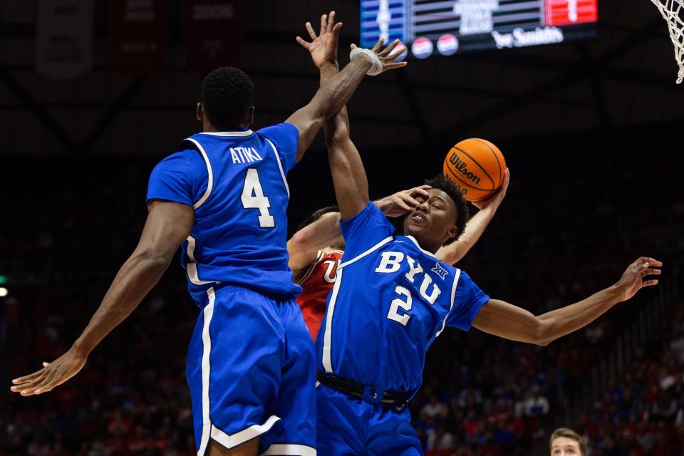 Utah Utes guard Rollie Worster’s (25) hand hits Jaxson Robinson (2) while defending him during a men’s basketball game at the Jon M. Huntsman Center in Salt Lake City on Saturday, Dec. 9, 2023. | Megan Nielsen, Deseret News