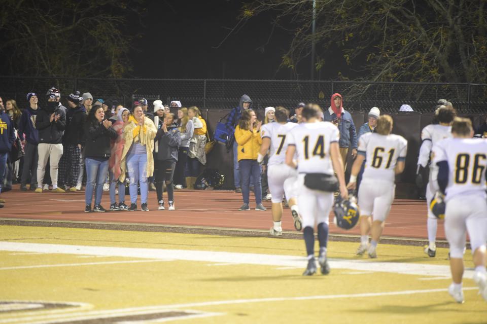 Eastern York football players walk off the field to an ovation from their fans following a road playoff game against Milton Hershey Friday, Nov. 3, 2023. Eastern York lost, 29-23, to finish 7-4. It was the program's first winning season and playoff appearance in nine years.