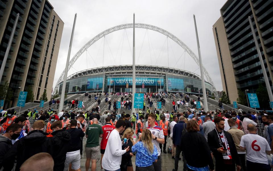 Fans gather outside Wembley ahead of the match - PA