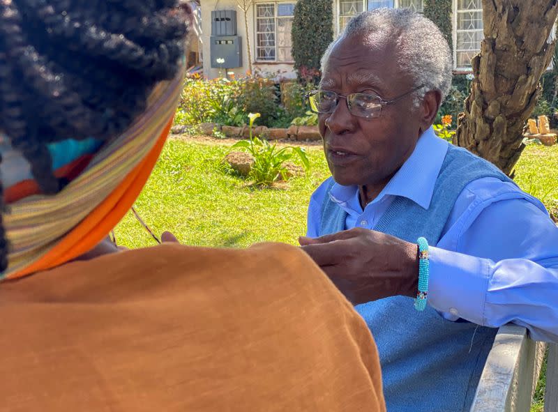 Daniel Sindiyo, whose mother was in the British detention camps of the pre-independence Mau Mau rebellion, talks to his granddaughter Chao Tayiana, a digital historian reconstructing 3D models of the detention camps, in Ngong