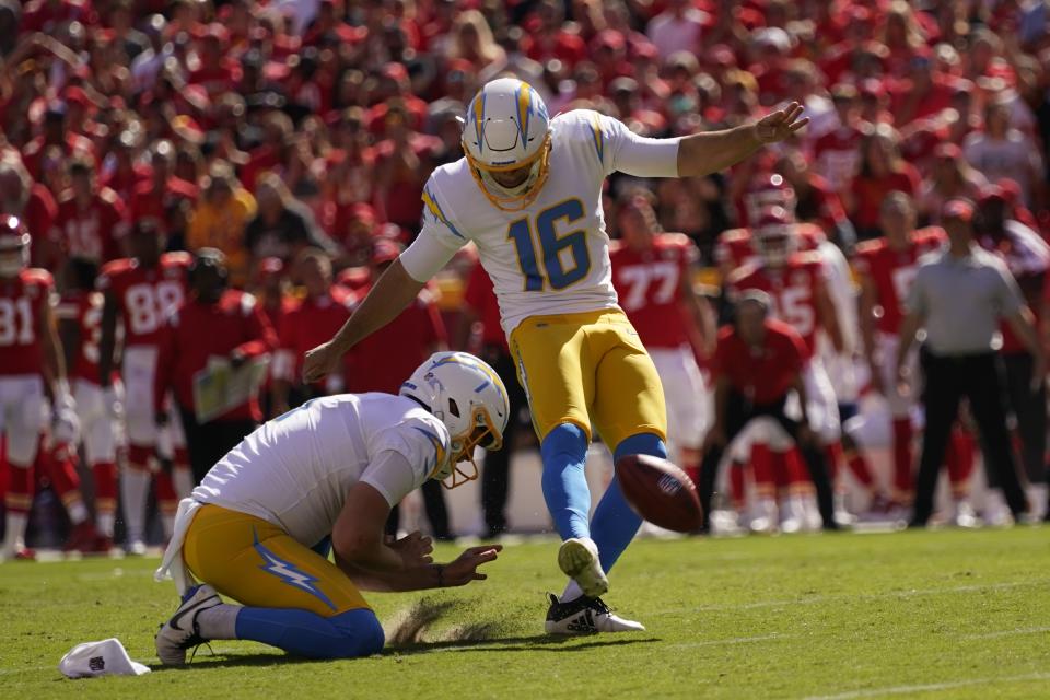 Los Angeles Chargers kicker Tristan Vizcaino (16) kicks a field goal out of the hold of Ty Long (1) during the second half of an NFL football game against the Kansas City Chiefs, Sunday, Sept. 26, 2021, in Kansas City, Mo. (AP Photo/Charlie Riedel)