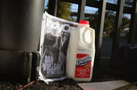 INDIANAPOLIS, IN - OCTOBER 17: A jug of milk is sits at the gate of the Indianapolis Motor Speedway along with other tributes left by fans to two-time Indianapolis 500 winner Dan Wheldon on October 17, 2011 in Indianapolis, Indiana. Wheldon, winner of the 2011 Indy 500, was killed in a crash yesterday at the Izod IndyCar series season finale at Las Vegas Motor Speedway. (Photo by Scott Olson/Getty Images)