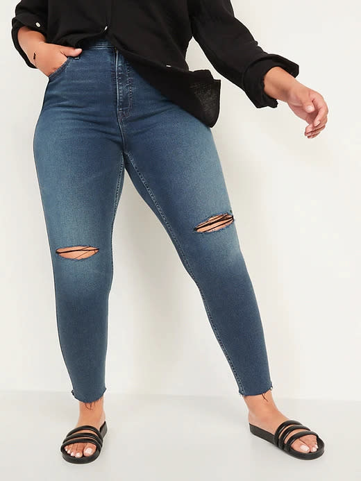 Extra High-Waisted Rockstar 360&#xb0; Stretch Super Skinny Ripped Ankle Jeans. Image via Old Navy.
