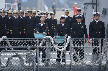 Japanese navy personnel is seen as their Maritime Self-Defense Force destroyer JS Suzutsuki (DD 117) arrives at Qingdao Port for the 70th anniversary celebrations of the founding of the Chinese People's Liberation Army Navy (PLAN), in Qingdao, China April 21, 2019. REUTERS/Jason Lee