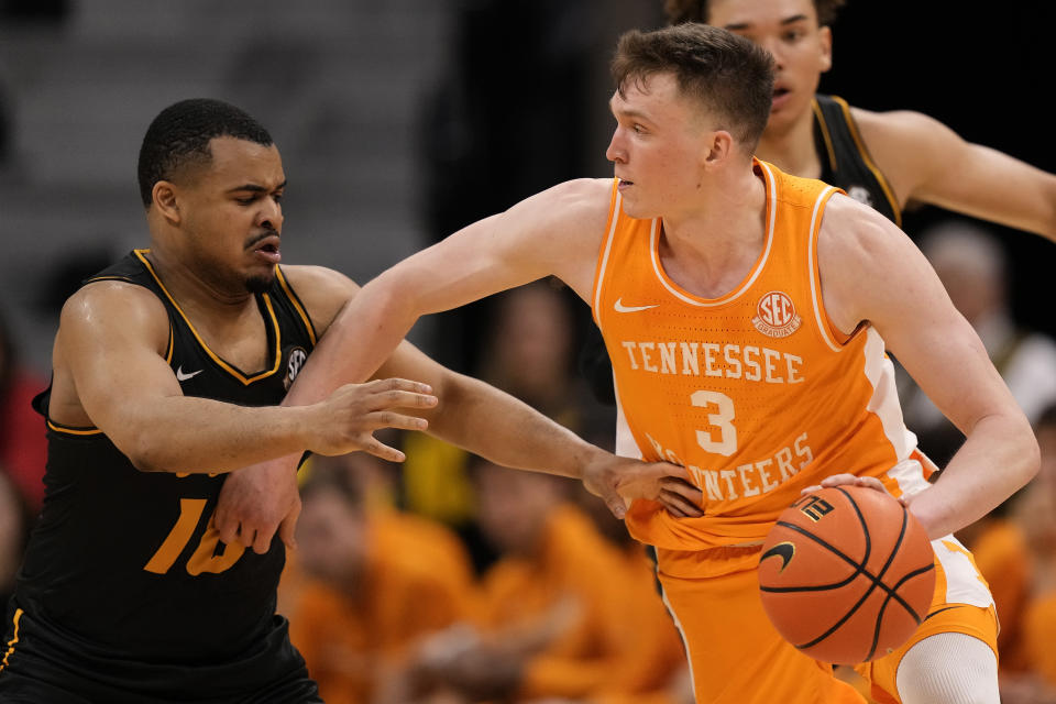 Missouri guard Nick Honor (10) pressures Tennessee guard Dalton Knecht (3) during the second half of an NCAA college basketball game Tuesday, Feb. 20, 2024, in Columbia, Mo. Tennessee won 72-67. (AP Photo/Charlie Riedel)