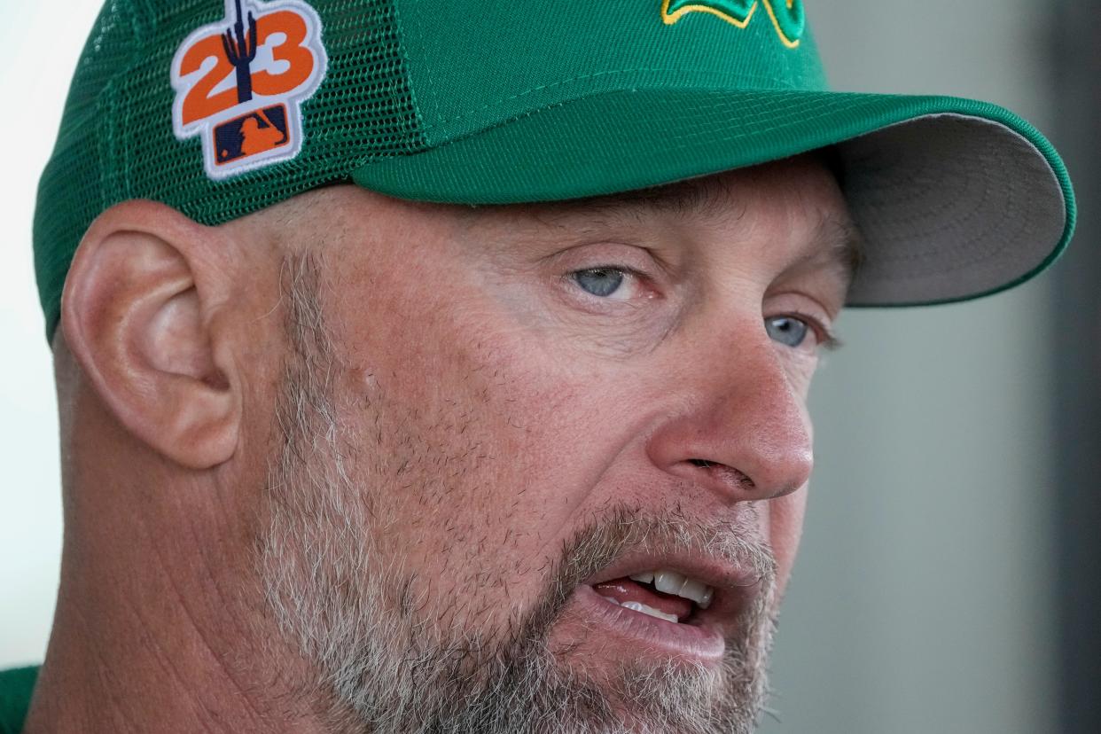 Oakland Athletics manager Mark Kotsay answers questions during a spring training baseball workout Monday, Feb. 20, 2023, in Mesa, Ariz. (AP Photo/Morry Gash)