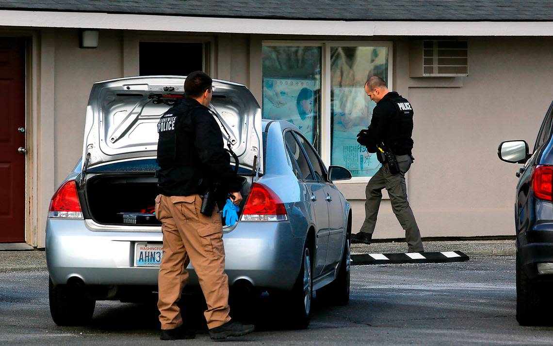 Kennewick police help federal agents search a massage business in Kennewick.