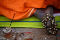 <p>A musical instrument is pictured on the feet of a Hindu holy man, or sadhu, as he sits at the premises of Pashupatinath Temple during the Maha Shivaratri festival in Kathmandu, Nepal, Feb. 24, 2017. REUTERS/Navesh Chitrakar </p>