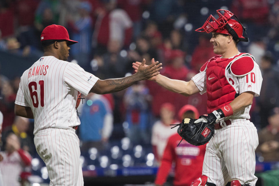 May 1, 2019; Philadelphia, PA, USA; Philadelphia Phillies relief pitcher Edubray Ramos (61) and catcher J.T. Realmuto (10) celebrate after defeating the Detroit Tigers at Citizens Bank Park. Mandatory Credit: Bill Streicher-USA TODAY Sports