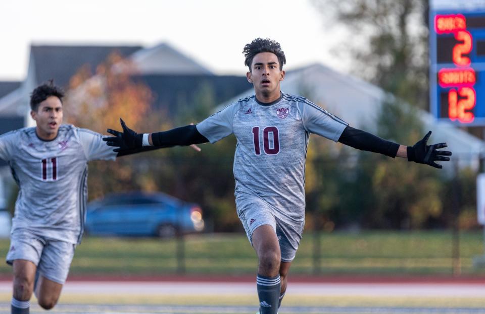 Caravel’s Zain Akhtar (10) celebrates his goal as his brother Zayd trails during the Buccaneers’ 4-0 win over Saint Mark's in the DIAA Division II Boys Soccer championship game Saturday, November 19, 2022 at Dover High School.