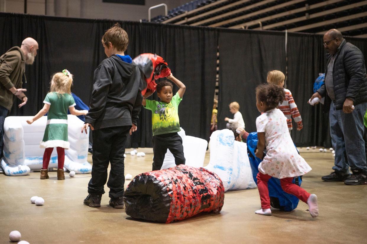 Attendees participate in the indoor snowball fight during the Winter Wanderland event at Kellogg Arena on Friday, Dec. 2, 2022.