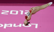 Canada's Rosannagh Maclennan performs during the women's trampoline qualification at the 2012 Summer Olympics, Friday, Aug. 3, 2012, in London. (AP Photo/Julie Jacobson)