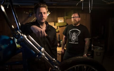 Spencer Bink and Mike Ashpaugh photographed with the chopper they're building in Ashpaugh's garage - Credit: Neville Elder for The Telegraph