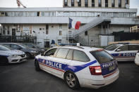 A police car arrives at the police station in the Paris suburb of Sarcelles, Tuesday, June, 15, 2021. The police station in Sarcelles was attacked in February by youths who launched noisy fireworks and threw stones, according to authorities. No injuries were reported but the attack was one of several targeting police stations that have heightened anxiety in police ranks. (AP Photo/Lewis Joly)