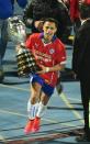 Chile's Alexis Sanchez celebrates with the trophy after winning the Copa America tournament, in Santiago, on July 4, 2015