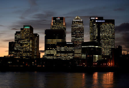 FILE PHOTO: The Canary Wharf financial district is seen at dusk in London, Britain November 7, 2014. REUTERS/Toby Melville/File Photo