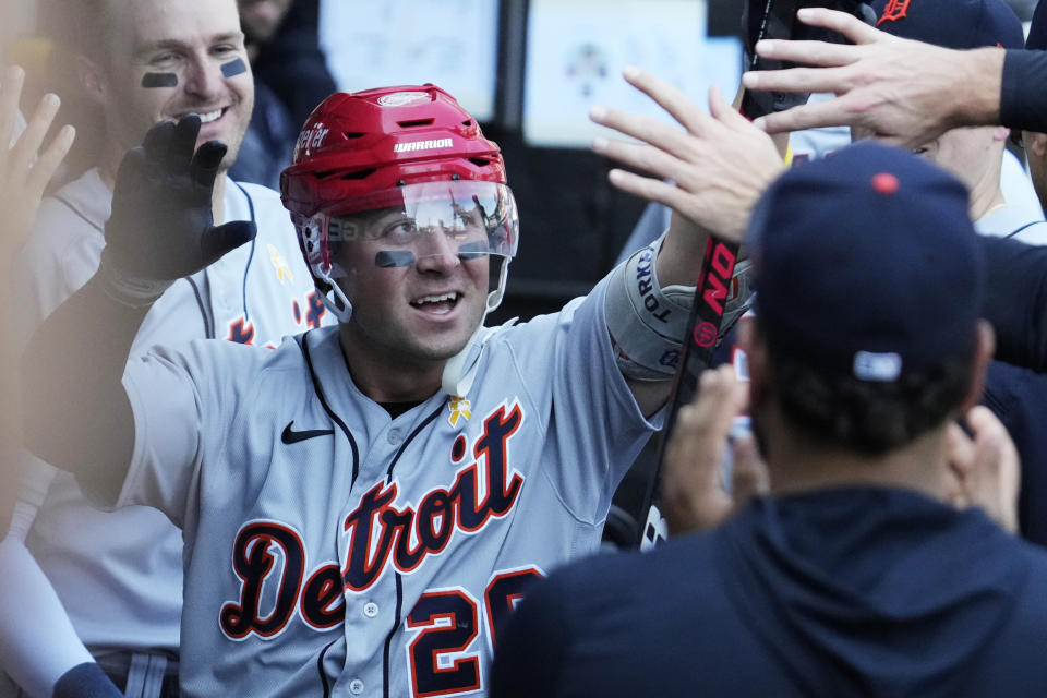 Detroit Tigers' Spencer Torkelson celebrates with teammates after hitting a solo home run during the seventh inning of a baseball game against the Chicago White Sox in Chicago, Sunday, Sept. 3, 2023. (AP Photo/Nam Y. Huh)