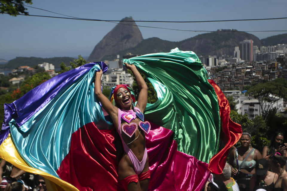 Raquel Poti performs on stilts during the Carmelitas street party on the first day of Carnival in Rio de Janeiro, Brazil, Friday, Feb. 9, 2024. (AP Photo/Bruna Prado)