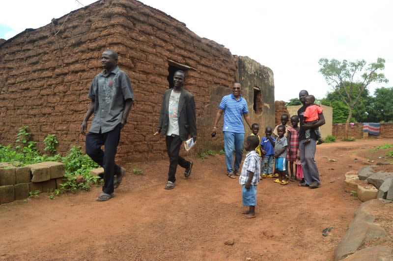 Ibrahima Keita walks with relatives in Bamako