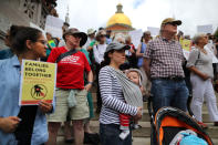 <p>Demonstrators gather outside the Massachusetts State House in Boston to protest the Trump administration’s policy of separating children from their parents when they cross the U.S. border without authorization on June 14, 2018. (Photo: John Tlumacki/The Boston Globe via Getty Images) </p>