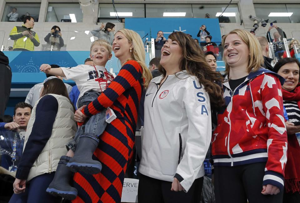 Ivanka Trump holds Luke Shuster, son of Team USA skip John Shuster, next to athletes Rebecca Hamilton and Cory Christensen, while watching the men’s curling gold medal game. (Getty)