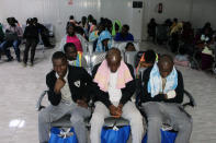 Migrants from Mali wait at Misrata airport before their return to their countries, in Misrata, Libya September 20, 2018. REUTERS/Ayman al-Sahili