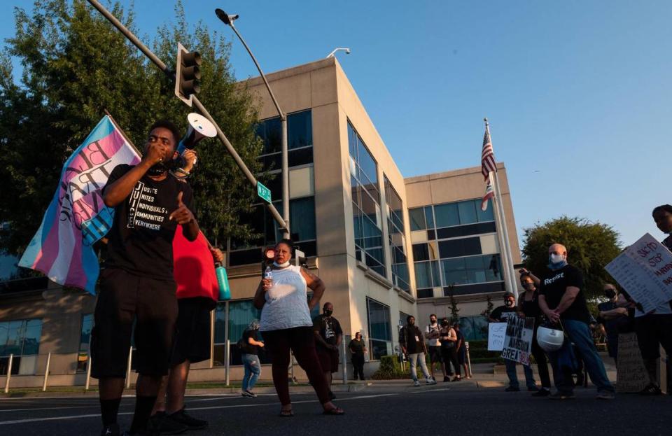 Nehemiah “Nuk Nuk” Johnson, left, with Justice Unites Individuals & Communities Everywhere of Sacramento, speaks at the Black Lives Matter Sacramento protest in front of the Richards Police Facility on Saturday, Aug. 1, 2020.