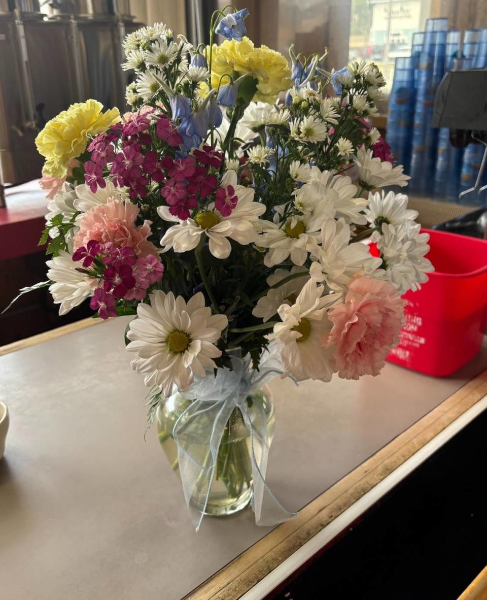 Ernie Ross said someone left a bouquet of flowers outside his restaurant. It came with a note that said, “Rest in peace Tammy. We are going to miss you.” Emalyn Muzzy/emuzzy@thesunnews.com