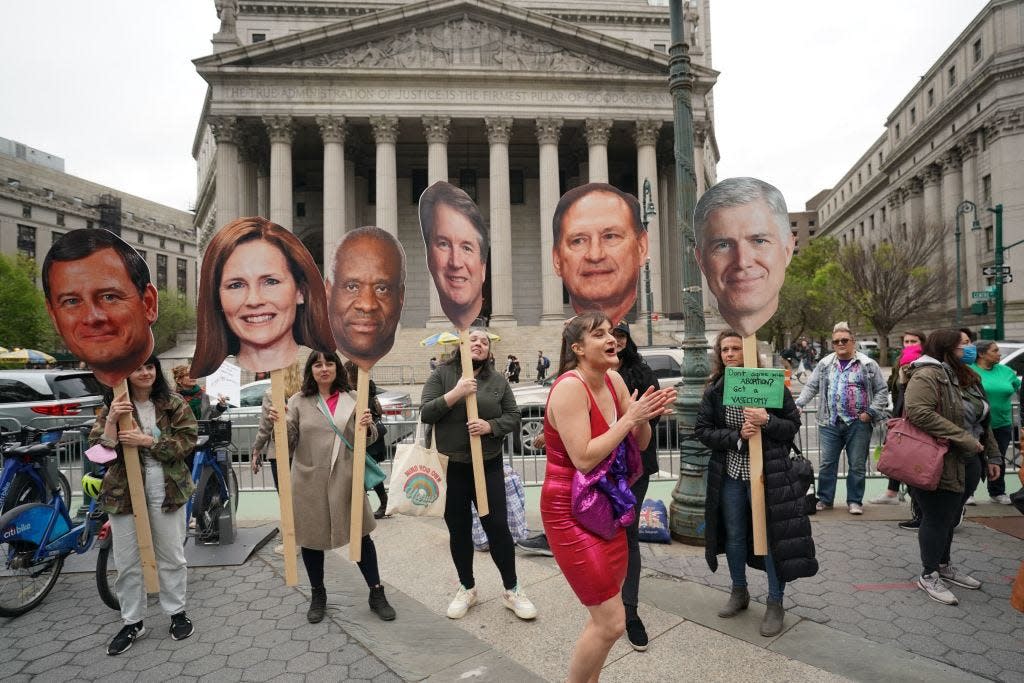 Protesters hold up cardboard cutouts of Supreme Court justices in New York on May 3, 2022 following the leak of a draft opinion suggesting overturning Roe vs. Wade.