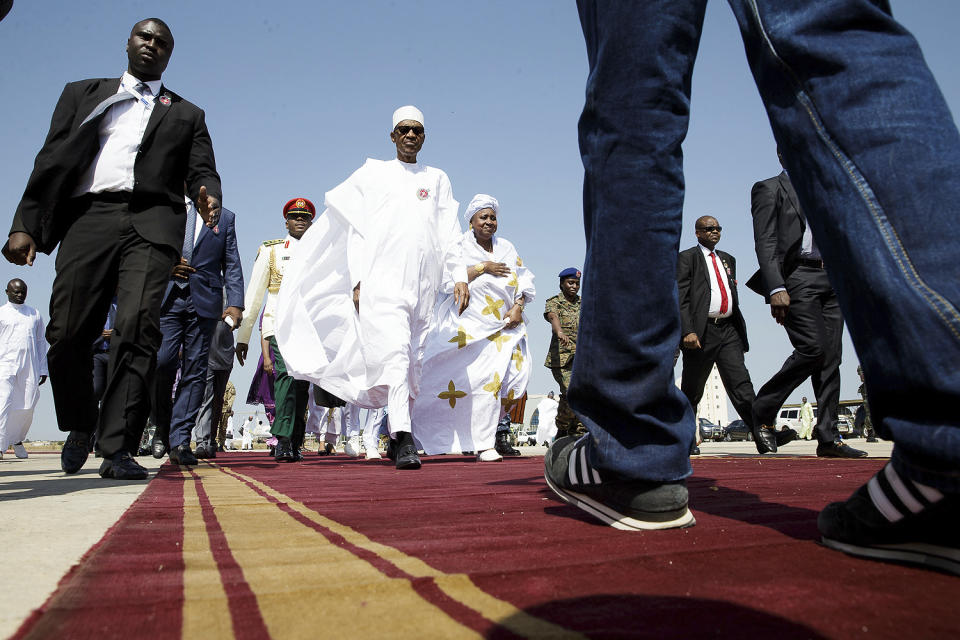 In this photo released by the Nigeria State House, Nigeria President Muhammadu Buhari. centre, arrives for a meeting with Gambia President, Yahya Jammeh, in Banjul Gambia, Friday Jan. 13, 2017. Nigeria's president was leading a regional delegation to Gambia in a last-ditch attempt Friday to persuade its longtime leader to step down and allow his rival's inauguration next week, while fears grow that the impasse could turn violent. (Bayo Omoboriowo/Nigeria State House via AP)