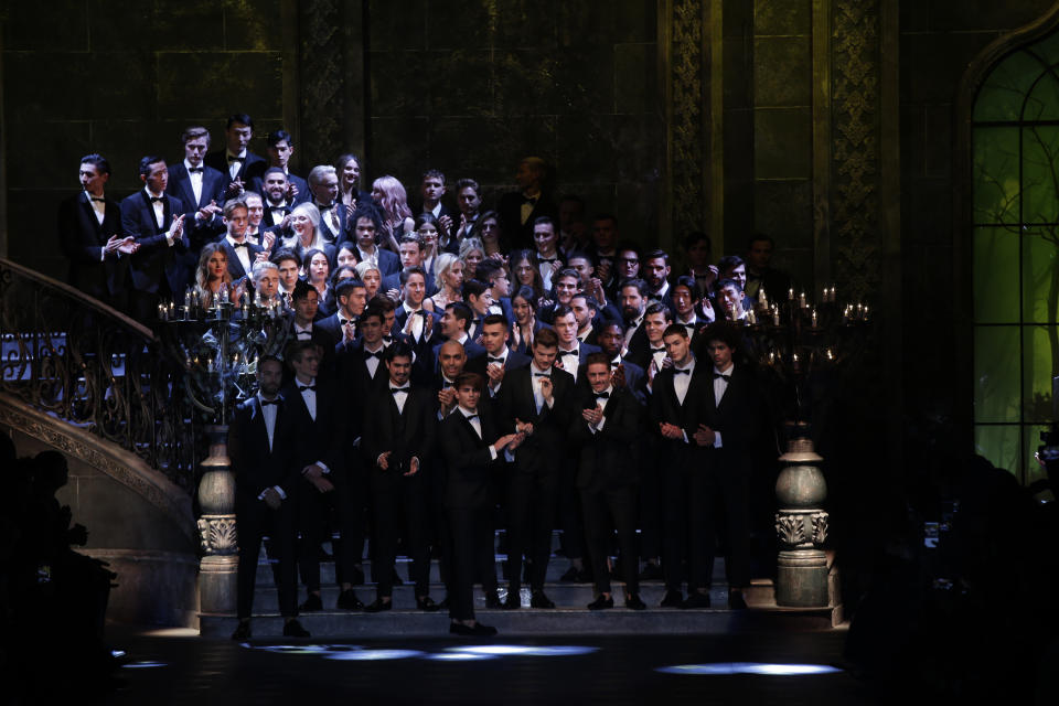 Models wear creations for Dolce & Gabbana men's Fall-Winter 2017-2018 collection, part of the Milan Fashion Week, unveiled in Milan, Italy, Saturday, Jan. 14, 2017. (AP Photo/Luca Bruno)