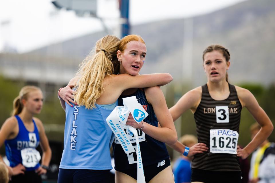 Timpview’s Jane Hedengren hugs Westlake’s Shelby Jensen after finishing first and second respectively during the girls 1,600 during the BYU Track Invitational at the Clarence F. Robison Outdoor Track & Field in Provo on May 6, 2023. | Ryan Sun, Deseret News