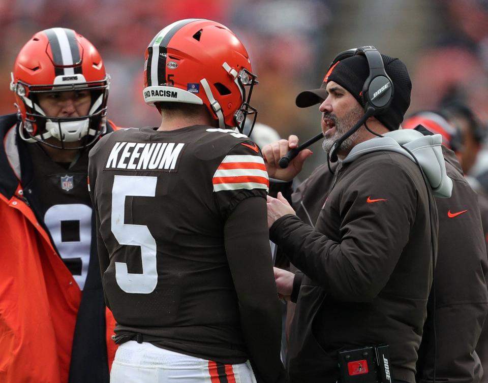 Browns head coach Kevin Stefanski has a word with quarterback Case Keenum (5) during the first half Sunday, Jan. 9, 2022, in Cleveland.