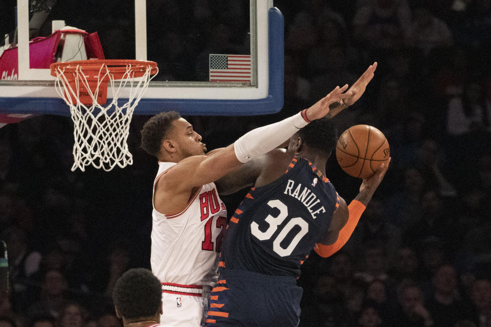 New York Knicks forward Julius Randle (30) scores against Chicago Bulls forward Daniel Gafford (12) during the first half of an NBA basketball game, Saturday, Feb. 29, 2020 in New York. (AP Photo/Mark Lennihan)