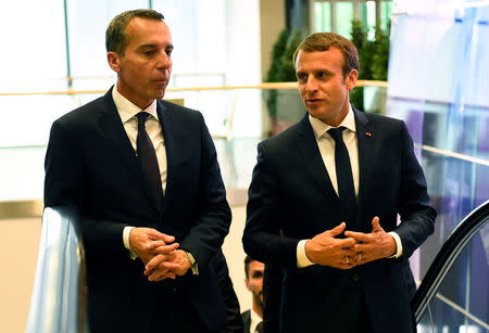 Austrian chancellor Christian Kern (L) and French President Emmanuel Macron arrive for a meeting at the Congress palace in Salzburg, Austria, August 23, 2017. REUTERS/Bertrand Guay/Pool