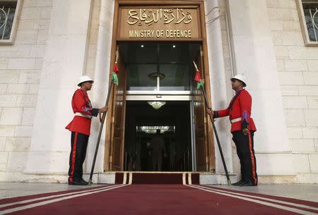 Iraqi guards stand in front of the Ministry of Defence during a visit from U.S. Secretary of Defense Chuck Hagel, in Baghdad December 9, 2014. U.S. Defense Secretary Chuck Hagel arrived in Baghdad on Tuesday as the United States expands its presence and touts progress against Islamic State militants four months after starting a campaign of air strikes in Iraq. REUTERS/Mark Wilson/Pool (IRAQ - Tags: POLITICS MILITARY)