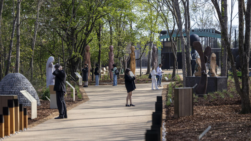 Members of the media explore the site during a media tour of Equal Justice Initiative's new Freedom Monument Sculpture Park, Tuesday, March 12, 2024, in Montgomery, Ala. (AP Photo/Vasha Hunt)