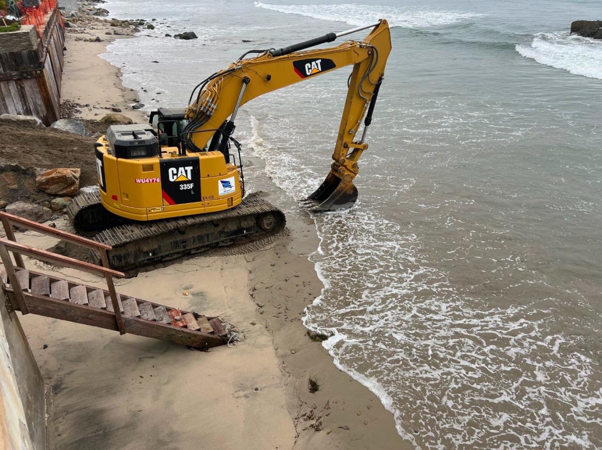 An excavator on Malibu's Broad Beach.