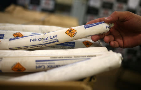 A police chief handles a portion of 200 kilograms of explosive emulsion, regularly used by thieves during bank robberies, seized by the State Department of Criminal Investigations in Sao Paulo, Brazil February 8, 2019. REUTERS/Amanda Perobelli