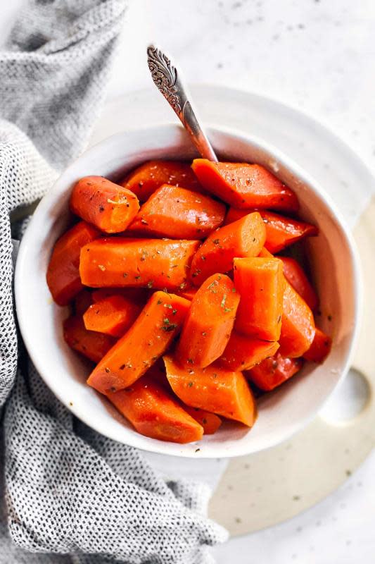 <p>Savory Nothings</p><p>Honey butter thyme crockpot glazed carrots are an easy and delicious side dish, perfect for holidays and special dinners. Sweet, buttery and perfectly tender, these keep your oven free and practically make themselves!</p><p><strong>Get the recipe: <a href="https://www.savorynothings.com/crockpot-glazed-carrots/" rel="nofollow noopener" target="_blank" data-ylk="slk:Crock Pot Glazed Carrots;elm:context_link;itc:0;sec:content-canvas" class="link ">Crock Pot Glazed Carrots</a></strong></p><p><strong>Related: <a href="https://parade.com/1188900/kristamarshall/crock-pot-vegetable-recipes/" rel="nofollow noopener" target="_blank" data-ylk="slk:30 Crock Pot Veggie Side Dishes;elm:context_link;itc:0;sec:content-canvas" class="link ">30 Crock Pot Veggie Side Dishes</a></strong></p>