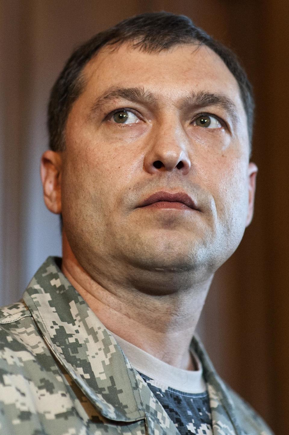 In this photo taken on Saturday, May 10, 2014, Valeriy Bolotov, people’s governor of Luhansk, pauses during a news conference the Ukrainian regional office of the Security Service in the eastern Ukraine city of Luhansk. On Tuesday, Russian news wires quoted insurgents as saying that unidentified assailants fired at a car in which Valery Bolotov, the leader of insurgency in the Luhansk region, was riding. Bolotov was hospitalized with wounds. Bolotov was the one to announce independence Monday for his region. (AP Photo/Evgeniy Maloletka)