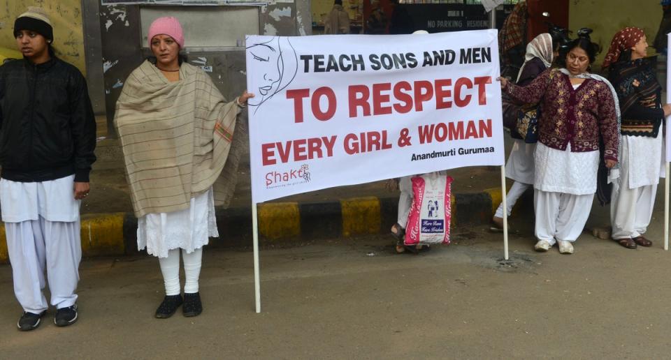 People gather to protest violence against women in New Delhi (AFP via Getty)