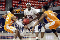 Auburn guard Devan Cambridge (35) tries to drive to the basket between Tennessee guard Victor Bailey Jr. (12) and Tennessee guard Yves Pons (35) during the first half of an NCAA basketball game Saturday, Feb. 27, 2021, in Auburn, Ala. (AP Photo/Butch Dill)