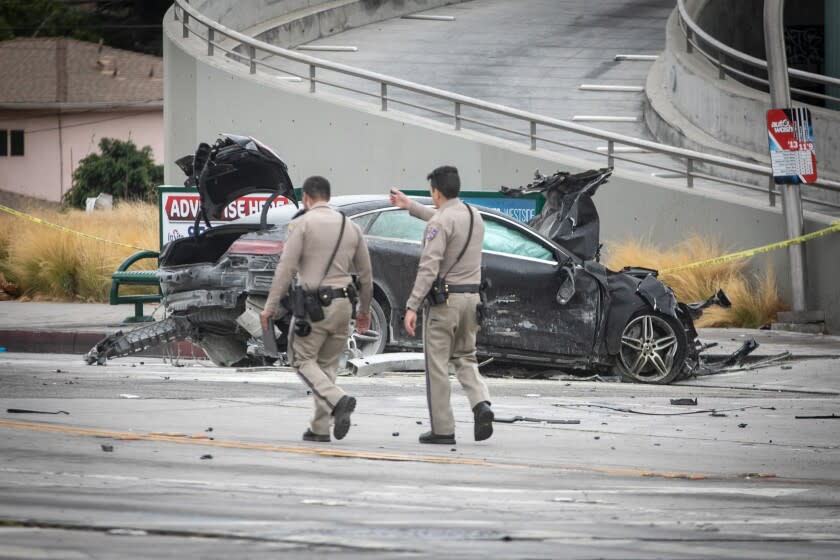 LOS ANGELES, CA - AUGUST 04: CHP and other officials investigate a fiery crash where multiple people were killed near a Windsor Hills gas station at the intersection of West Slauson and South La Brea avenues on Thursday, Aug. 4, 2022 in Los Angeles, CA. (Jason Armond / Los Angeles Times)