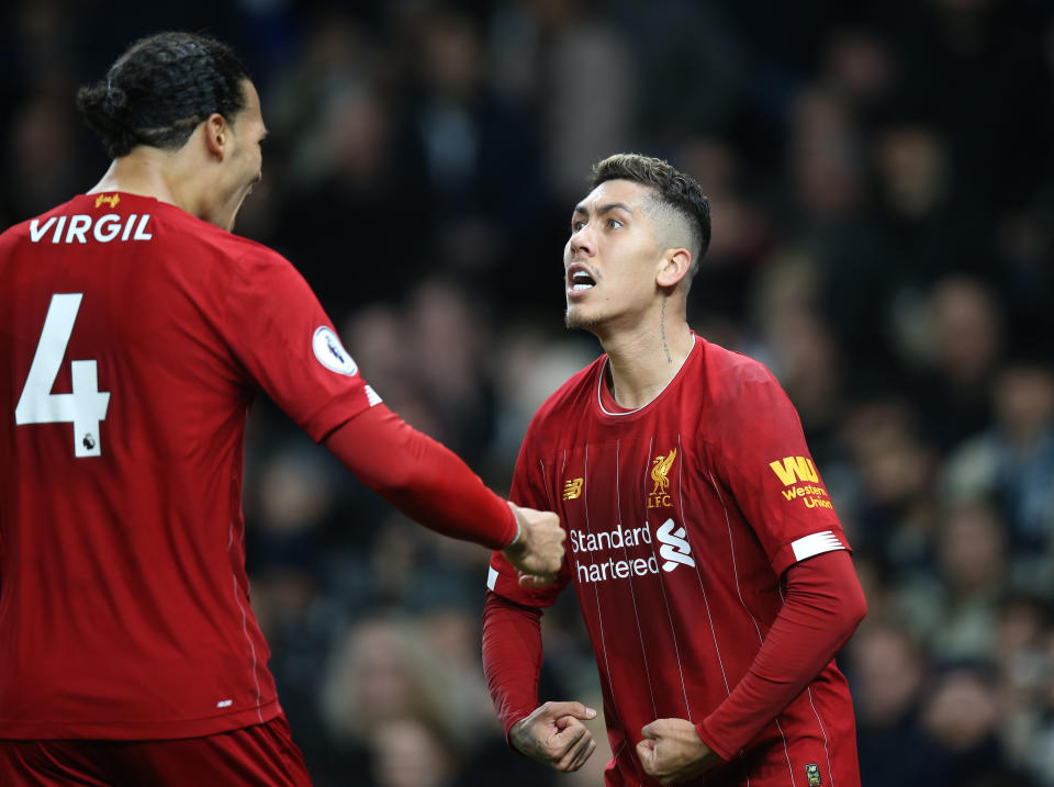 Roberto Firmino (right) and Liverpool have now earned more points after 21 games than any team in the history of Europe's top five leagues. (Photo by Mark Leech/Offside/Offside via Getty Images)