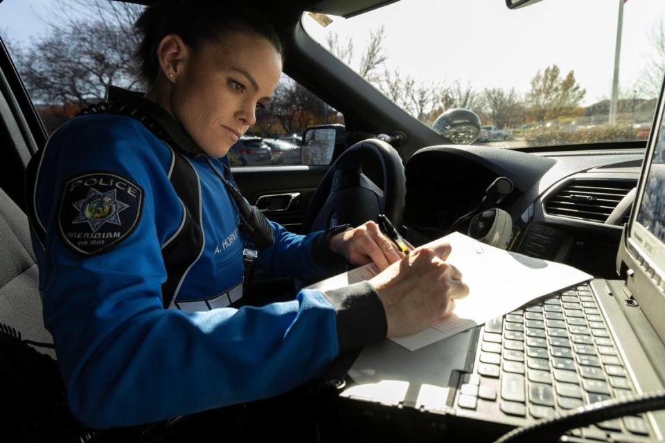 Ashley Horvath, with the Meridian Police Department, completes paperwork regarding a previous mental health related emergency.