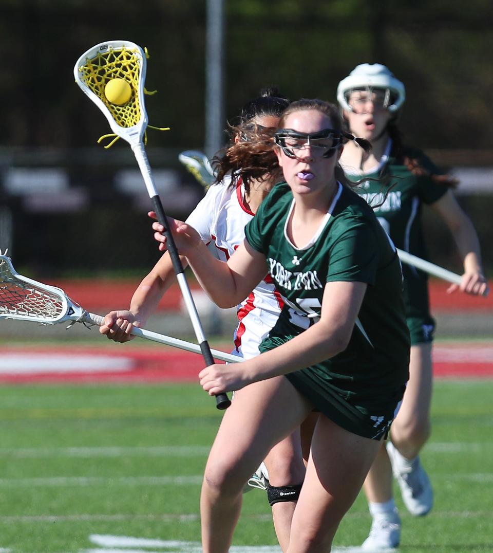 YorktownÕs Ava Cunneen (25) drives to the goal against Somers during girls lacrosse action at Somers High School April 25, 2024. Yorktown won the game 8-5.