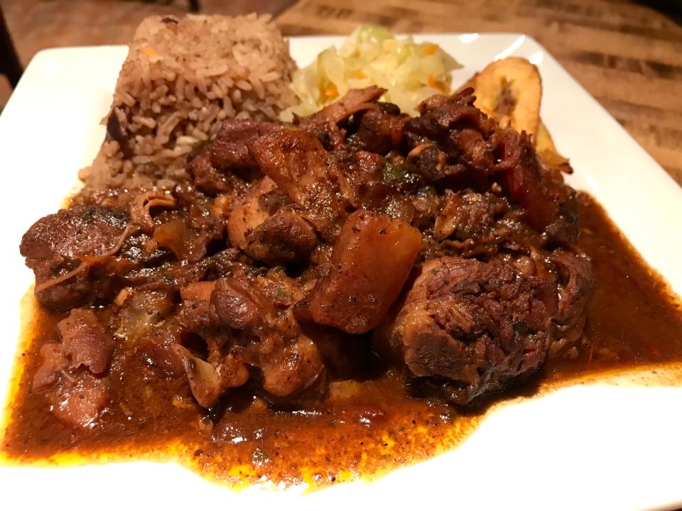 Jamaican brown stew chicken, served with rice and peas, cabbage and plantain, is the Wednesday special at Mobay Cafe in Walker's Point.
